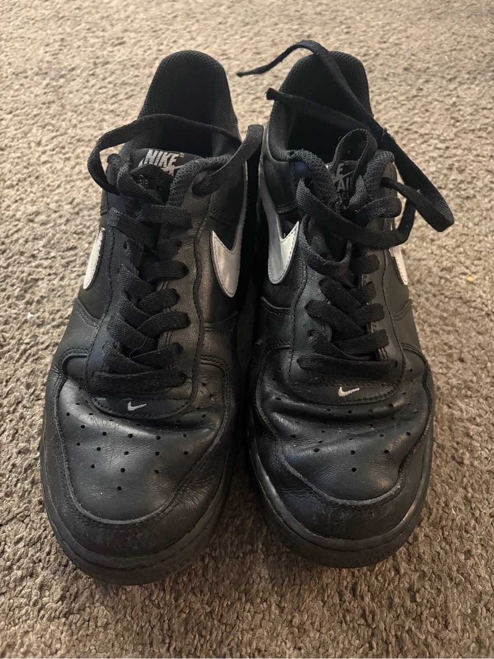 Nike Black Low-Top Sneakers with White Swoosh